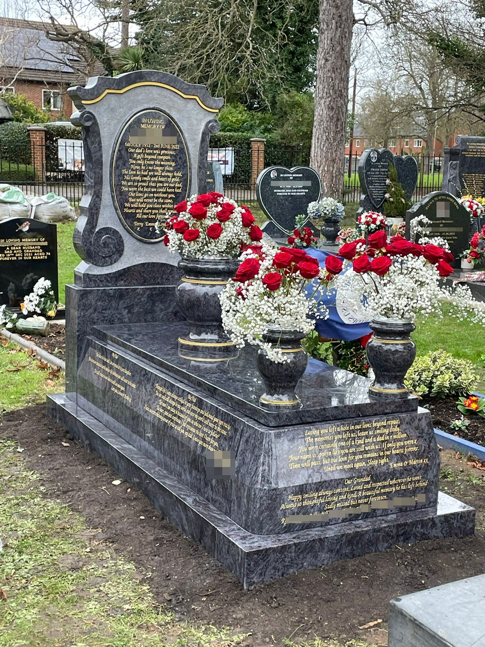 Bahama Blue Large Scroll shaped headstone on high sided kerb set with cover slab and 3 turned vases. Subtly pin lines added to highlight elements of memorial