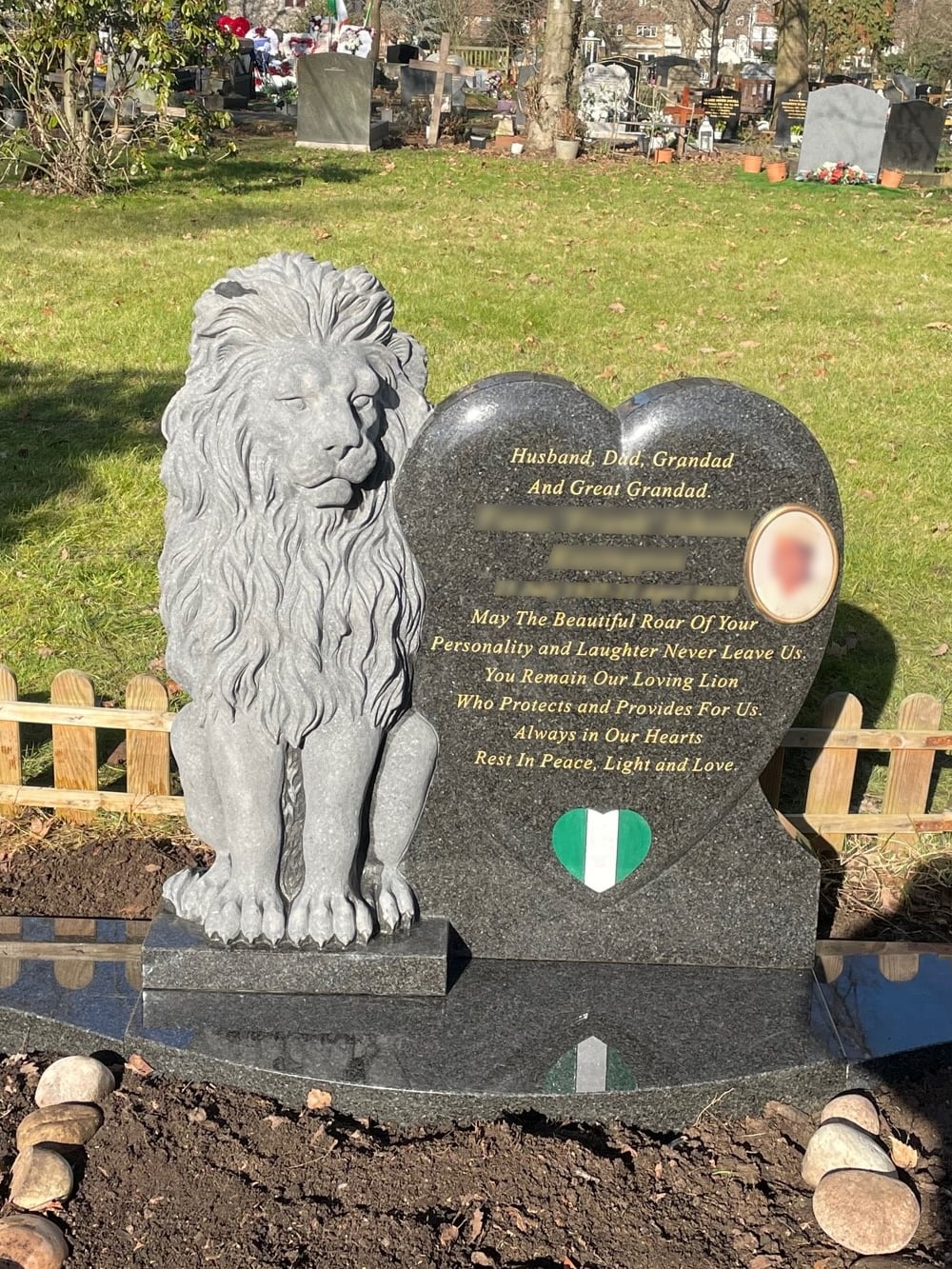 South African Grey Granite Hand Carved Lion sitting next to a curved face heart.