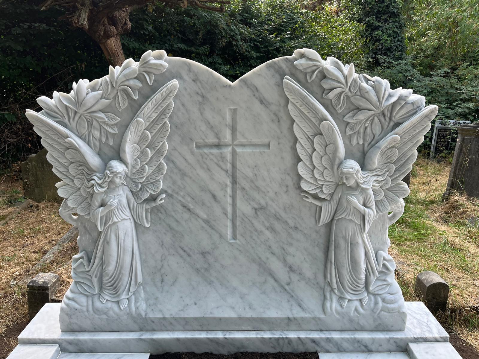 Exquisitely hand carved double Angel memorial in white Italian marble. With cover slab and marble wedge for lettering.