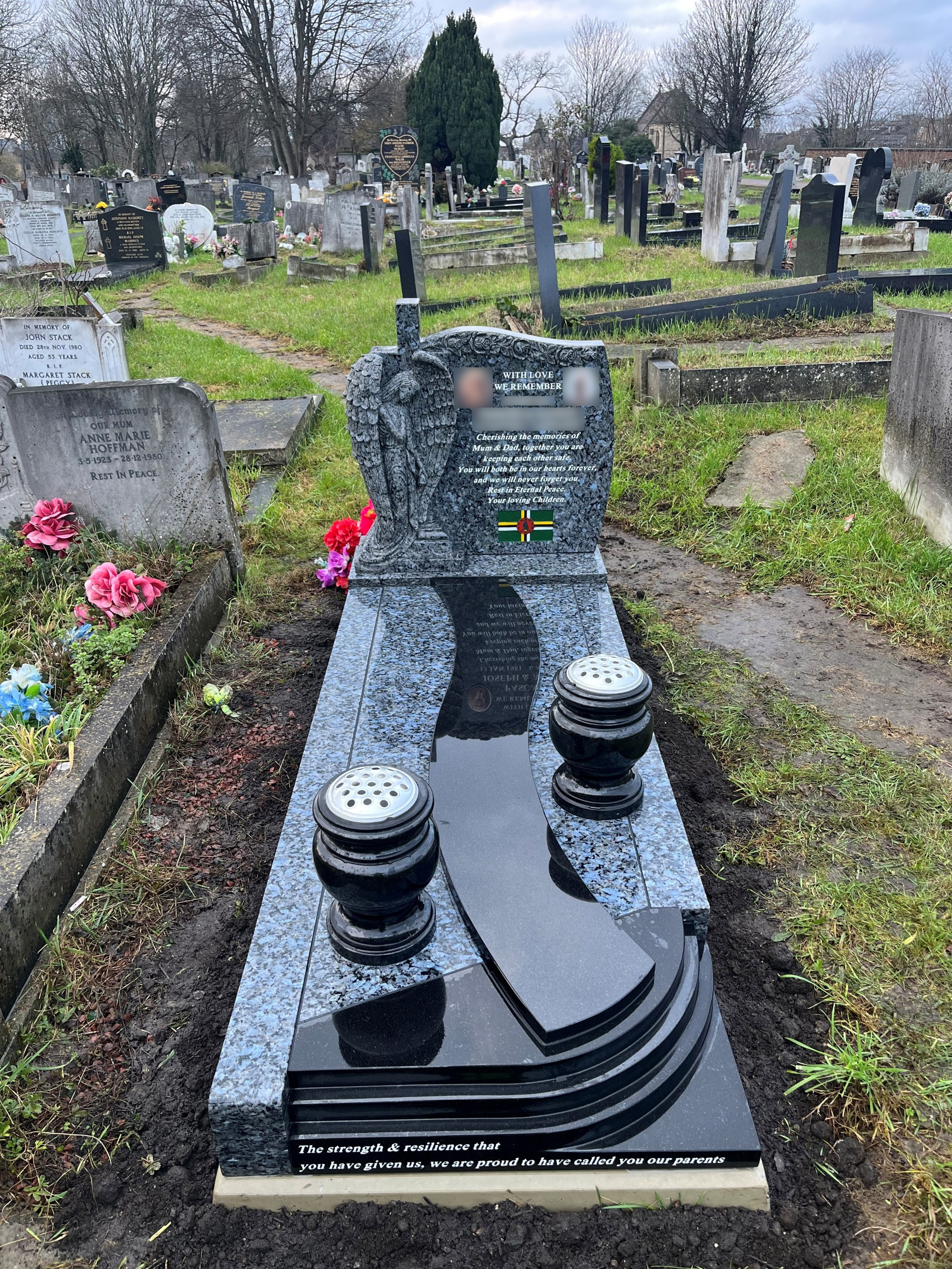 Blue Pearl and Black granite hand carved Caribbean Angel full memorial with hand carved roses and winding path and steps, with two turned vases.
