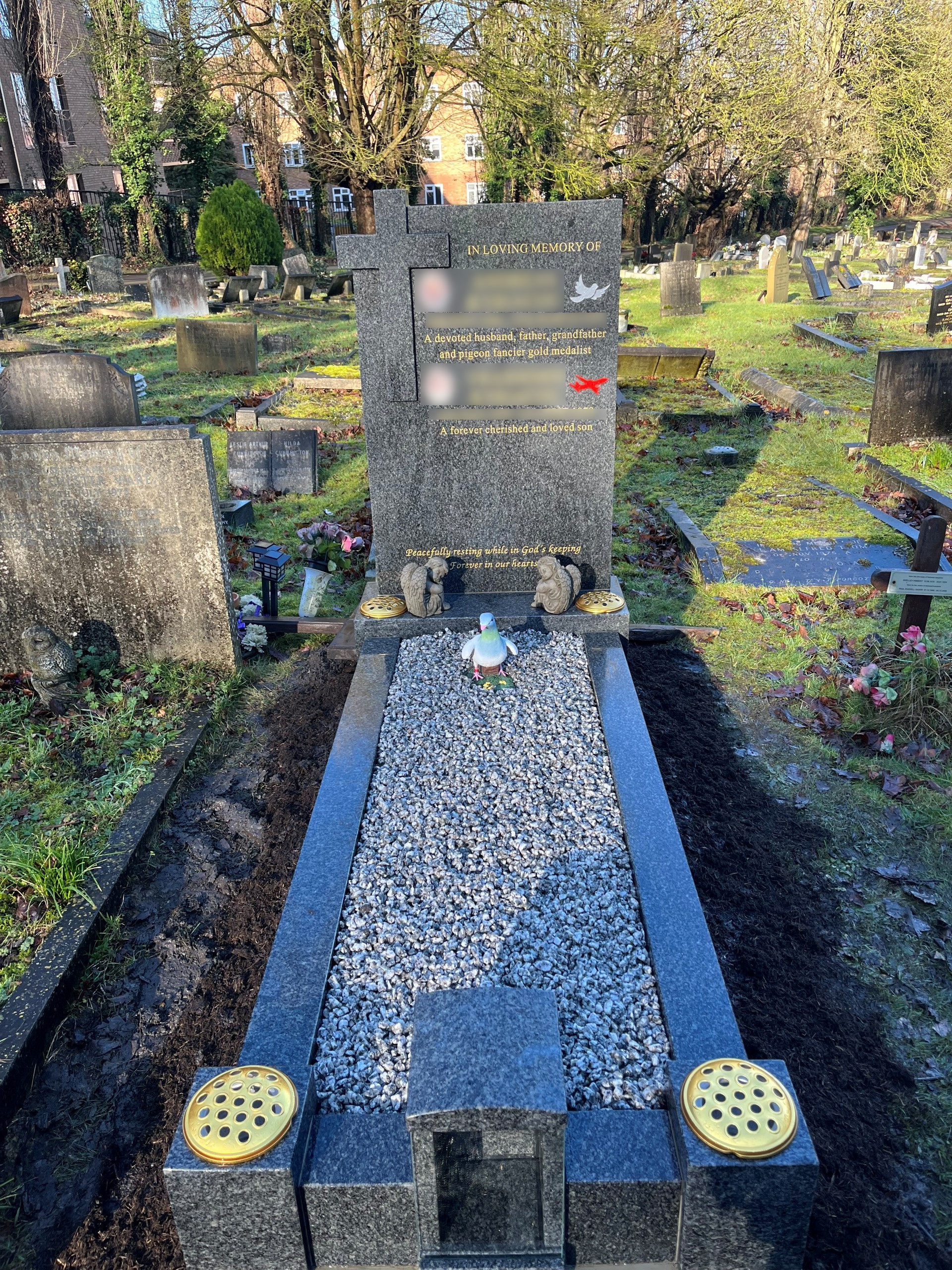 Glenaby Grey granite square top headstone with protruding cross full memorial includes candle box in the centre of the foot kerb, shown with light grey granite chippings.