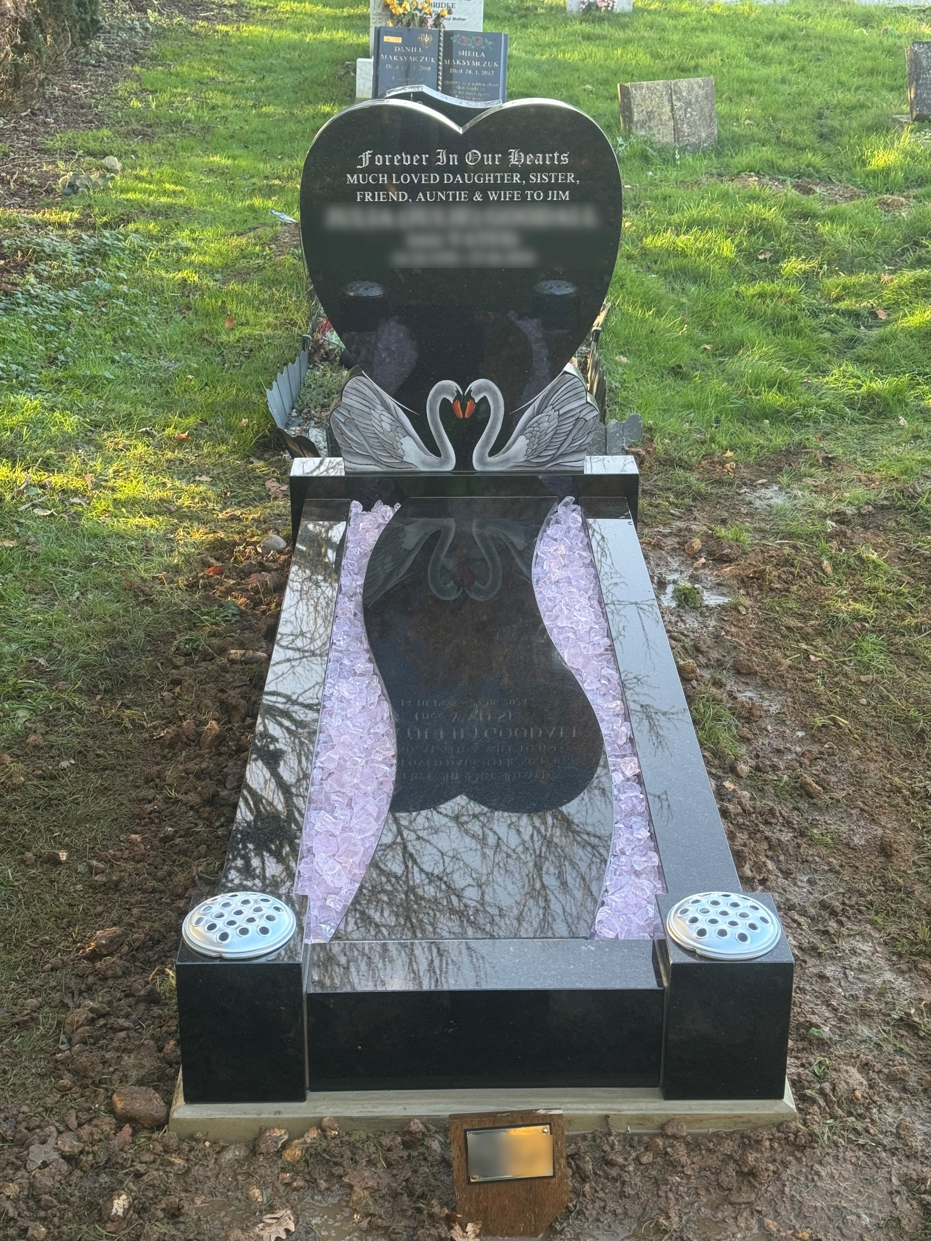 Star Galaxy granite heart full memorial with painted swans and winding path, shown with pink glass chippings.