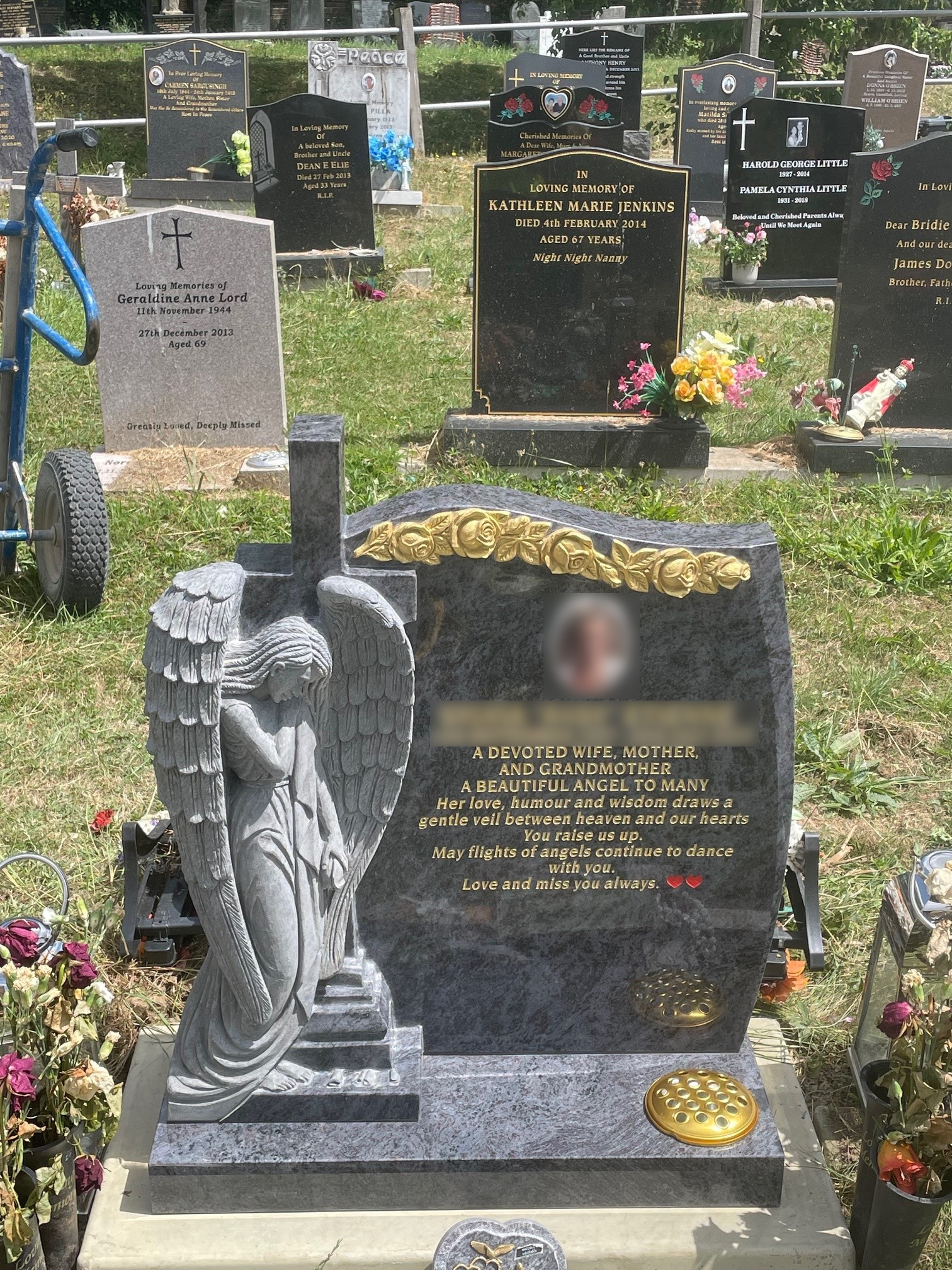 Bahama Blue granite Caribbean hand carved Angel with hand carved and painted gold roses.