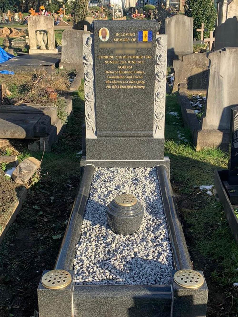 Dark Grey Granite Scroll design full memorial with carved roses, chippings and central vase.